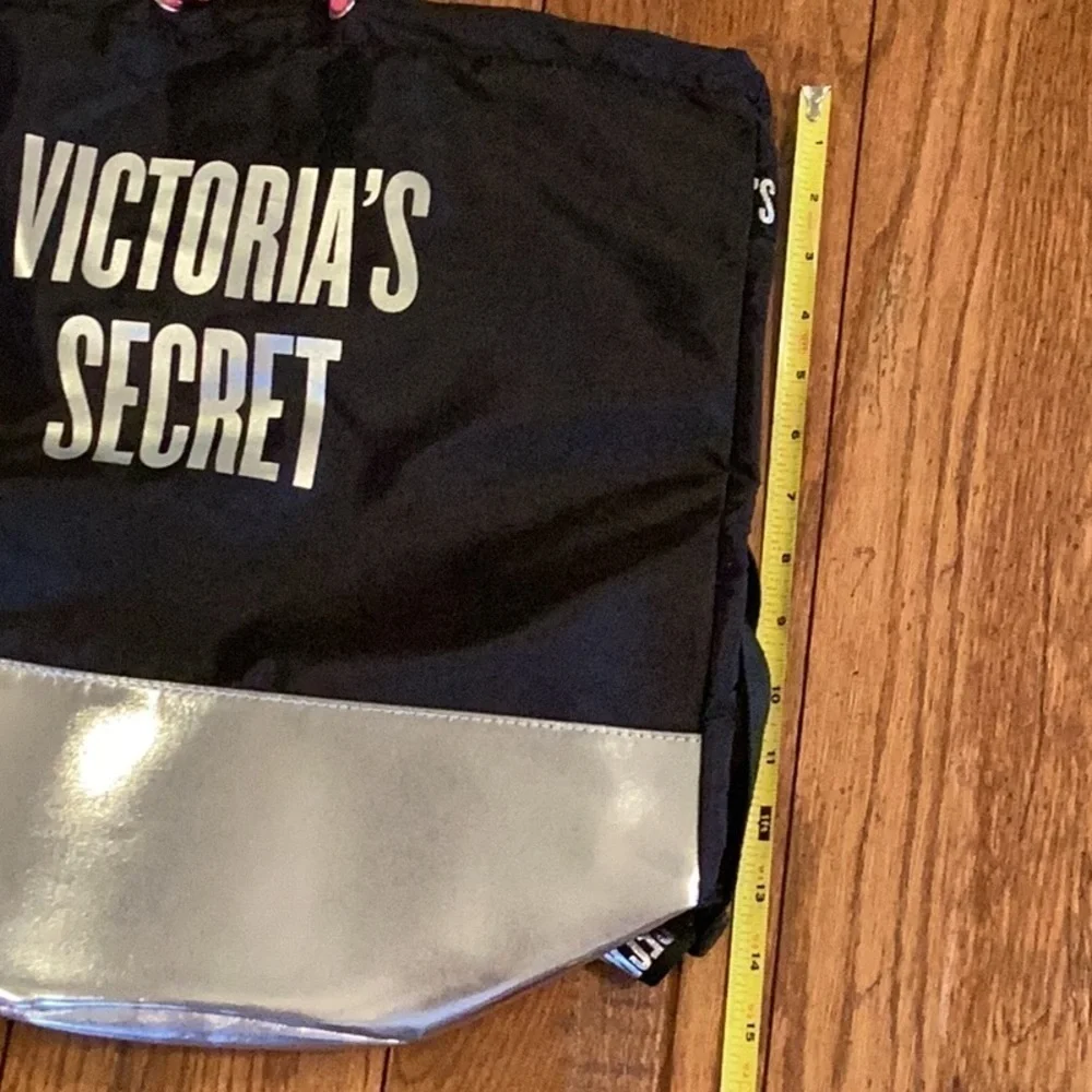 VICTORIA’S Secret black and silver backpack.